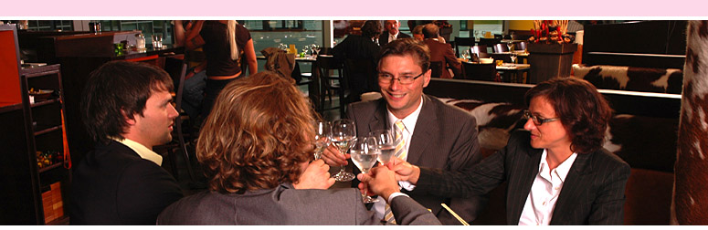 Restaurant facilities: Four guests are enjoying a glass of wine