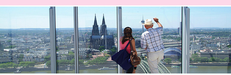 View from the K�lnTriangle Cologne View: Two tourists view Cologne Cathedral